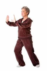 Senior woman doing Tai Chi Yoga exercise